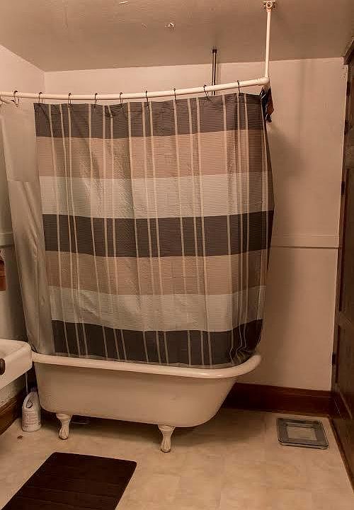 Bathroom with claw foot tub and shower