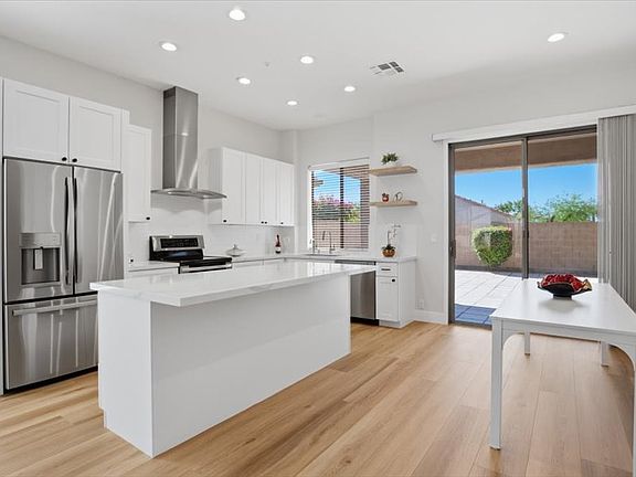 Kitchen with all new appliances, quartz countertops, Breakfast bar & Dinning area.