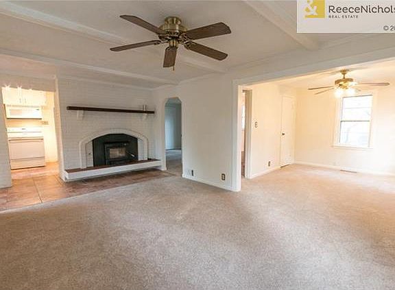 The living room from the other direction.  This shows the fireplace, ceramic floors in the kitchen/entry way, and to the right was a bedroom (put the wall back up to add the bedroom if needed).  This makes for a large living room or living room/dining roo