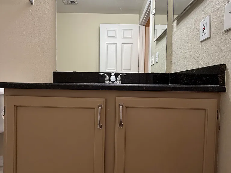 Bathroom 2: Clean and practical sink space.