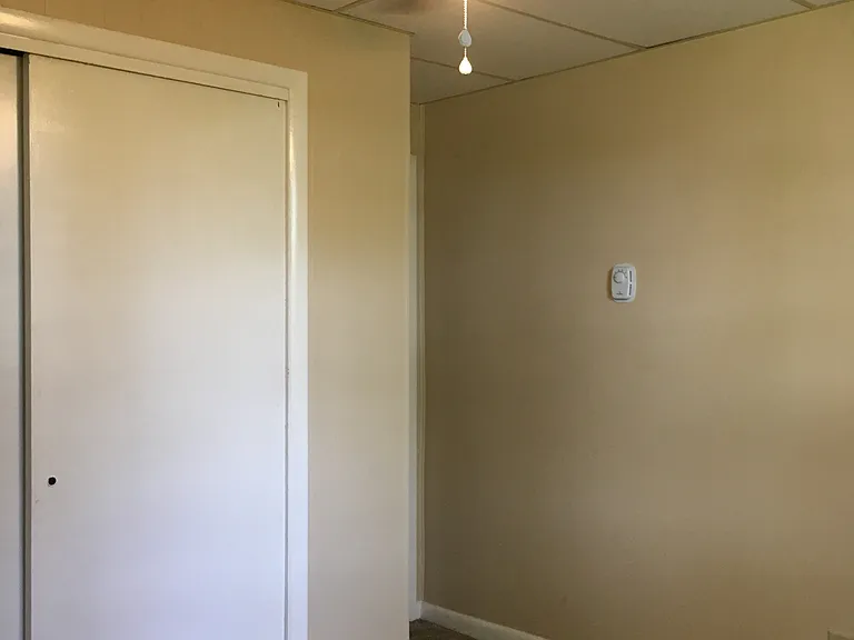 Rear bedroom is the smallest and measures 8 by 12. It has large closet and ceiling fan.
