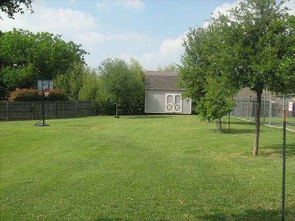 Backyard with view of shed