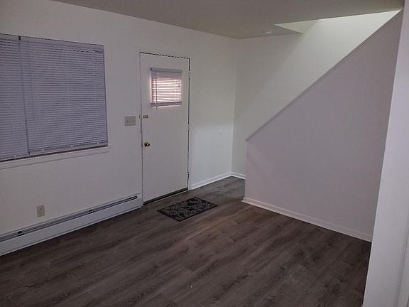living room: new paint, wood look tiling, new screen door