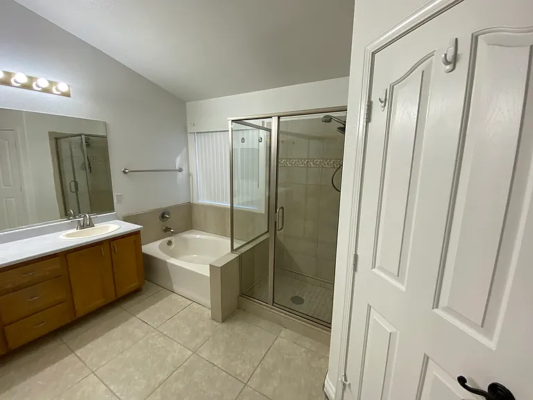 Bedroom #1 - Master bath double sinks, tub, and walk-in shower. Separate door to toilet.