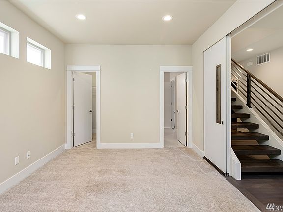 Den/5th bedroom has closet, direct access to 3/4 bath, and stylish sliding doors