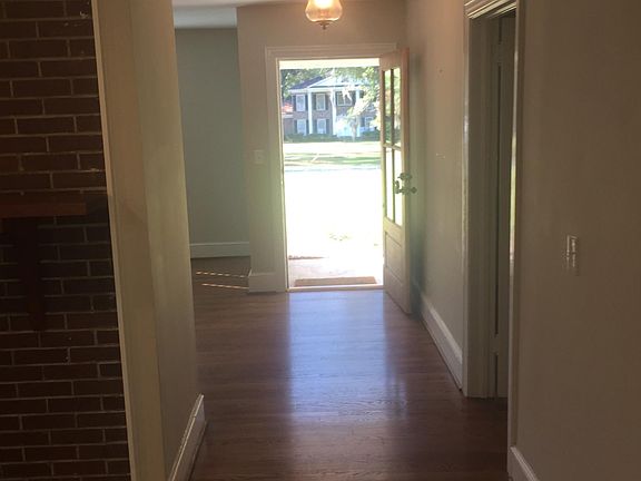 looking from kitchen out the front door - master bedroom in door to the right