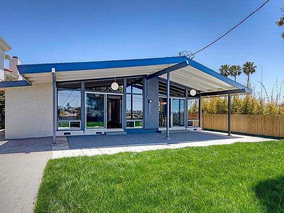 Back view of house, covered patio & yard