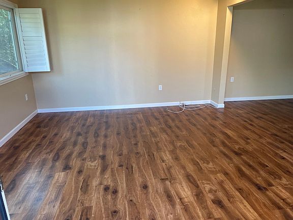 Smaller living room and part of dining area
