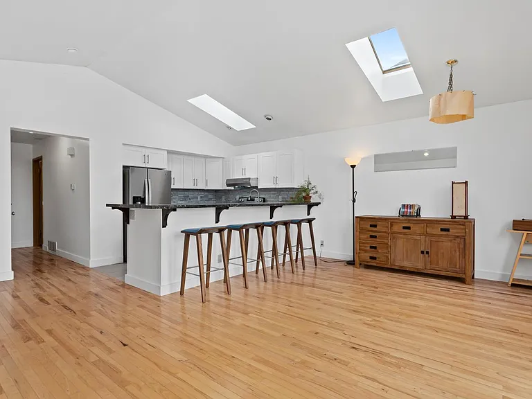 Kitchen with breakfast bar and dining area