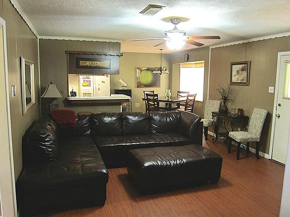 FAMILY ROOM/DEN OPEN FLOOR PLAN WITH VIEW OF BREAKFAST AND KITCHEN