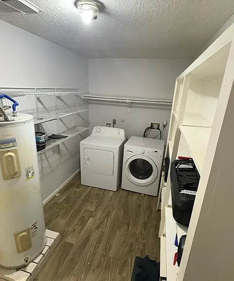 Utility room between kitchen and garage. Pantry and laundry.