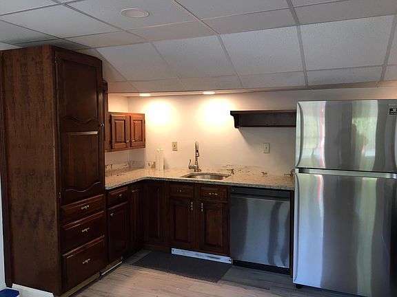 Left side of kitchen, cherry cabinetry and all new granite countertop,backsplash, porcelain gray tile, integral stainless steel sink, all appliances, and LED lighting
. New Cherry island with granite countertop being installed today, Wednesday!