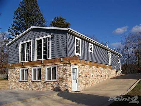 Front view of home showing preparations made to install decking