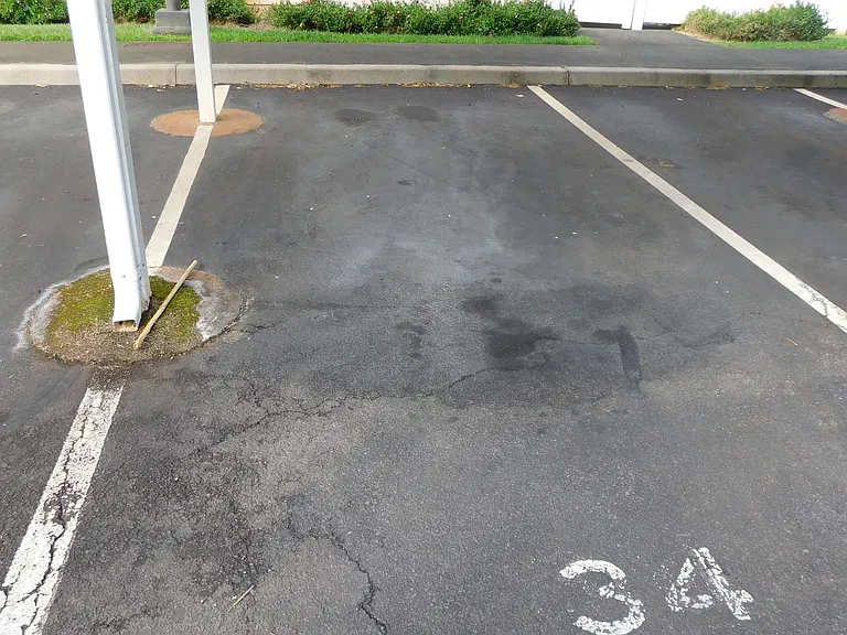 One assigned covered parking stall. One assigned uncovered parking stall nearby.