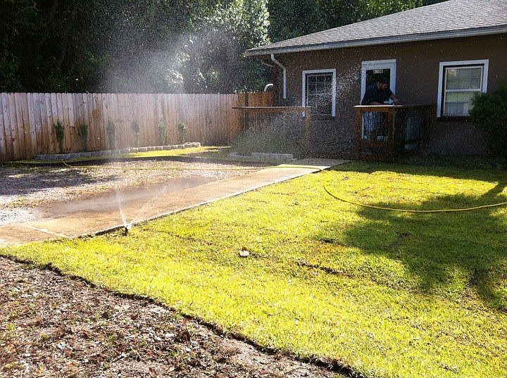 new front lawn, deck, and fencing