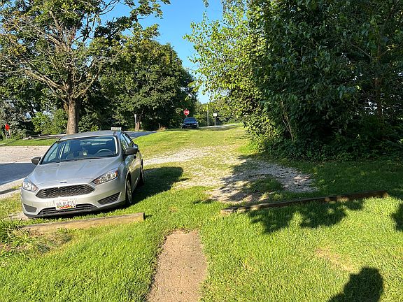 Off street parking area, by rear entrance.