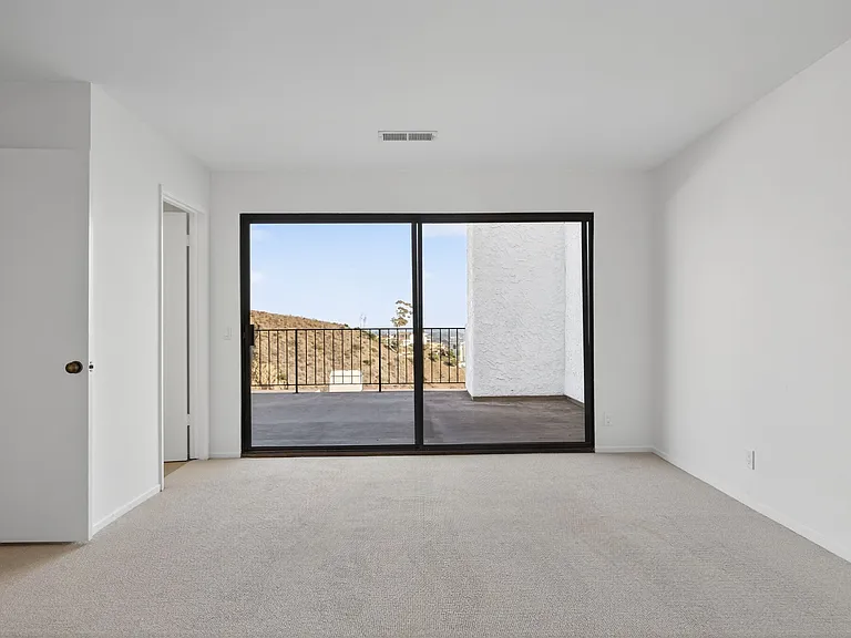 Top Floor Primary Bedroom & Balcony