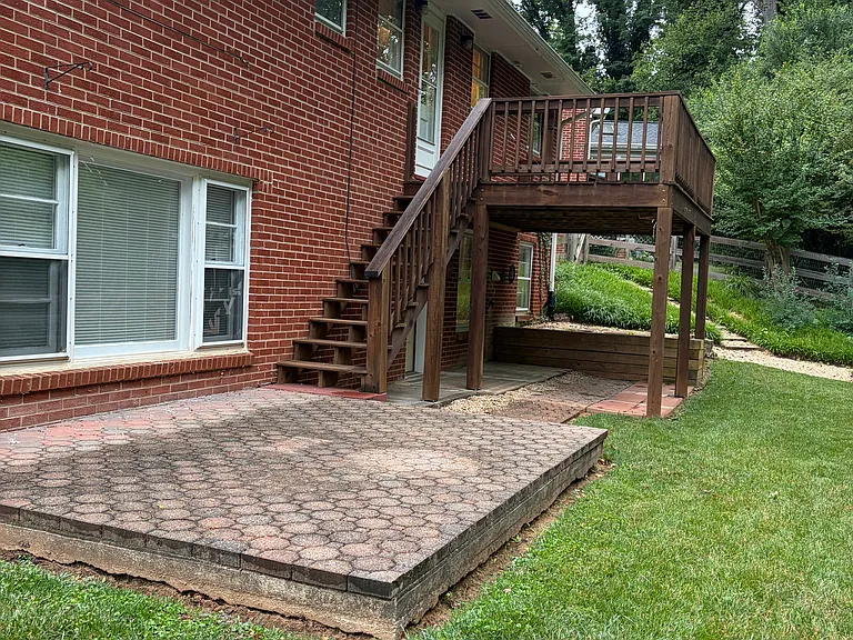 Exterior, fenced in yard, wooded.