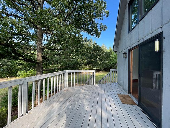 part of the deck off the side of the house, facing the pond. Great for grill, outdoor furniture.