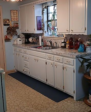 Painted cabinets new fridge.