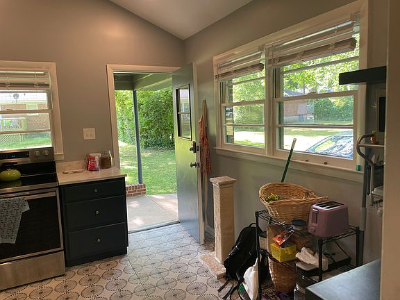 Convenient entry from the carport into the light-filled kitchen