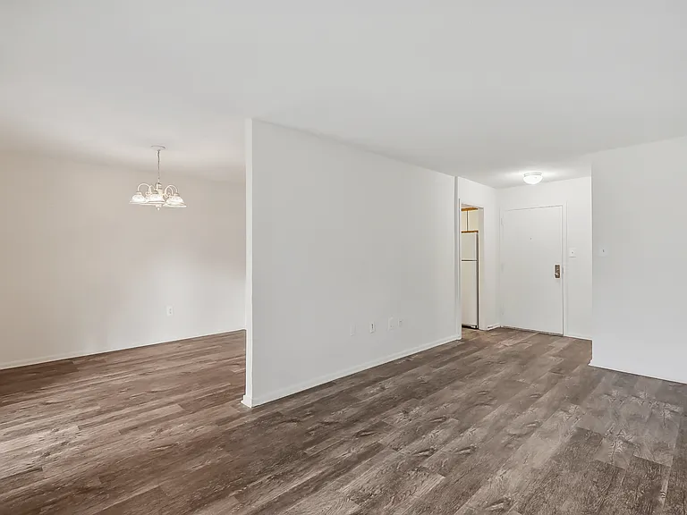 Open studio layout with hardwood-style flooring