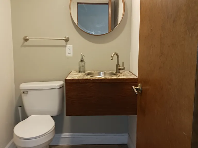Powder room off the dining and kitchen