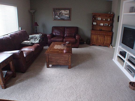 Family room includes gas fireplace, built-in shelves/entertainment center