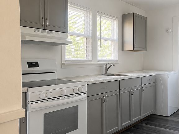 Kitchen with washer and dryer