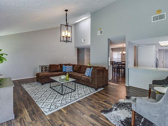 The family room is open to the kitchen thru the breakfast bar, which is perfect for entertaining or watchings the kiddos in the backyard while cooking