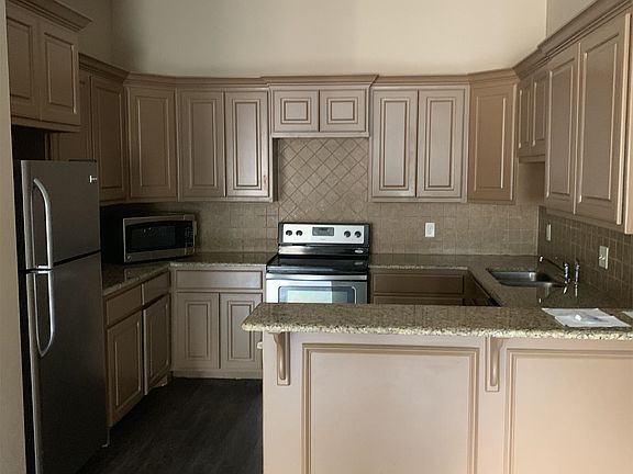 Beautiful kitchen with stainless steel appliances and granite counter tops