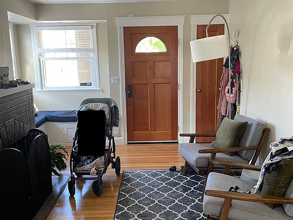 Living room and entry way (and redacted baby)