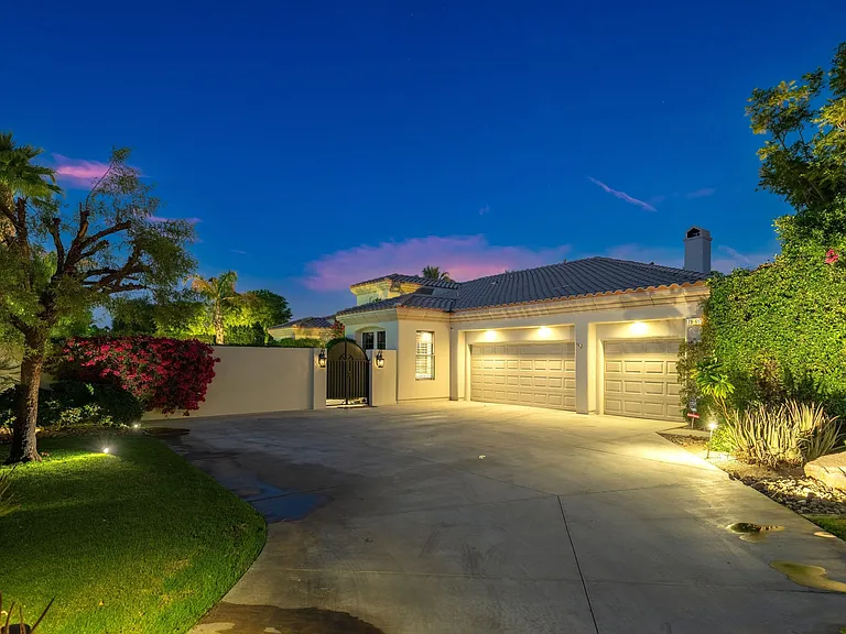 Tucked back in a corner lot with gated entry