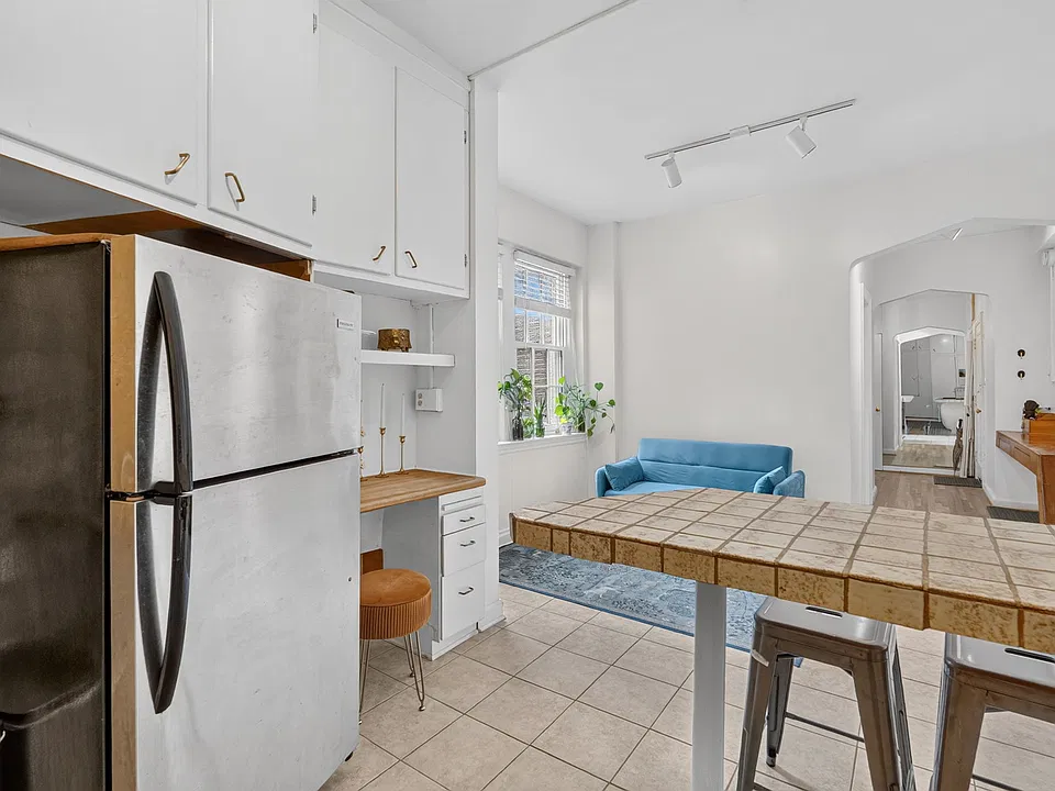 Spacious Kitchen with stools at the counter