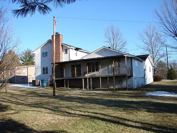 Large covered backdeck and partially fenced large back y