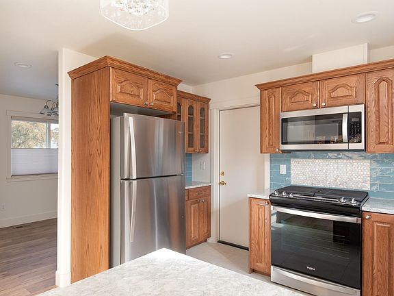 Kitchen with new stainless steel appliances and pantry