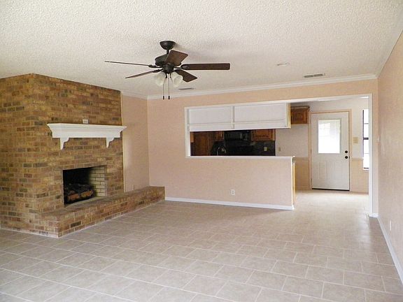 living room with gas log fireplace