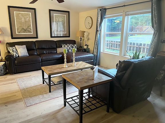 The warm and welcoming living room with a beautiful garden view.