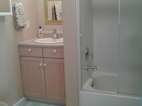 Full bath with tub and shower.