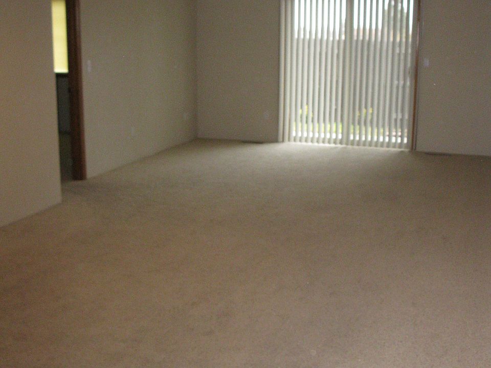 Front Room with slider out to covered patio and fenced yard