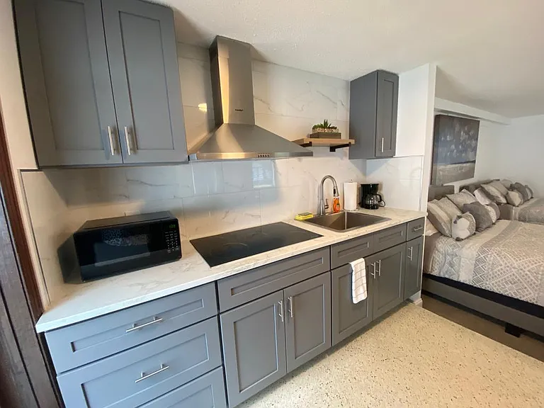 Fully equipped modern kitchen with dishwasher and essential comforts.