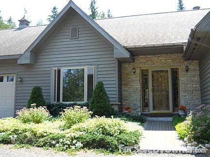 Front Entrance welcomes visitors!
						:
						Snow-on-the-Mountain and perennials surround the paver brick walkway