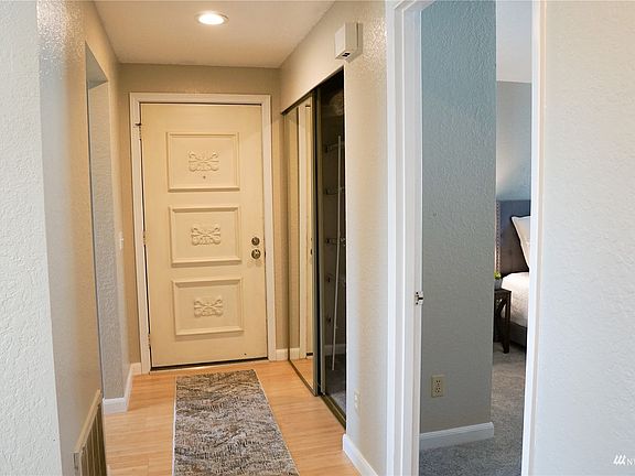 Front entry. Access to the kitchen is on the left. To the right is the storage and coat closet and entry to the secondary bedroom.>