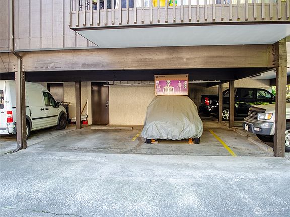 Two designated parking spaces with storage.>