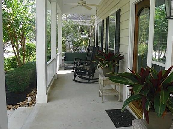 The front porch extends across the entire front of the home.