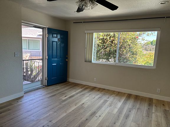 Living room to front door and window