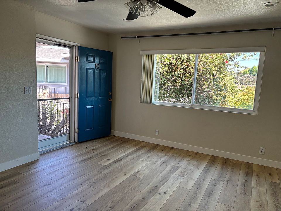 Living room to front door and window