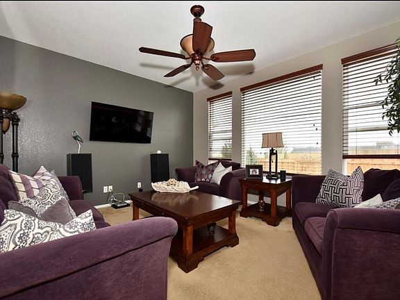 Living room w/ large picture window for natural light.