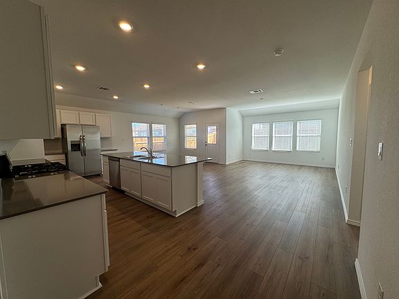 Open concept living, dining and kitchen.