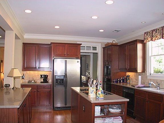 Entertainers kitchen with Silestone counters, Butlers pantry, view to fam rm